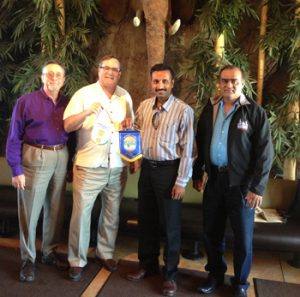 Mark Burchill, Wayne Rowlands and Vinay Patel with Rajeevalochan Dinamani of the Rotary Club of Bangalore, India