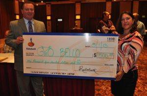 Doug Johnson with Manuela Gonzalez as she presents a check from Robobank