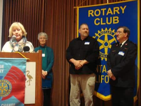 Eileen Carlisle introduces guests from the Salvation Army