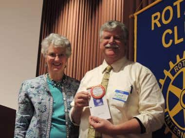 President Peggy with new Rotarian 