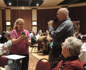 Karen Ball held the raffle number. Craig Meltzner gives the lengthy directions of what occurs next