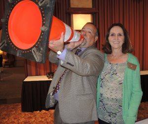 President Jose and Rotarian Jackie McMillian - Jose presented this cone to Don McMillian - absent