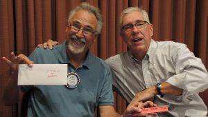 The first few raffle number drawings were for Sonoma County Fair passes. This is Rotarian Layne Bowen and Rotarian Jack Atkin fooling around. Layne had the winning number