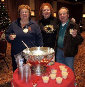 Queen Jeanne, Secretary Debi Zaft, and Chip Rawson sample some of the Rotary’s traditional egg nog to celebrate the holidays!