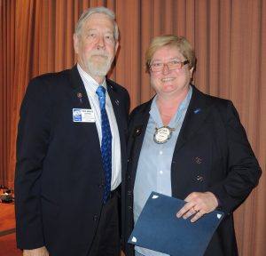 Julia Parranto is presented with her Paul Harris Society Award by past District Governor Bruce Campbell