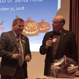 Dan Balfe presents a basket from the Foundation Dinner to President Tony who held the winning ticket.